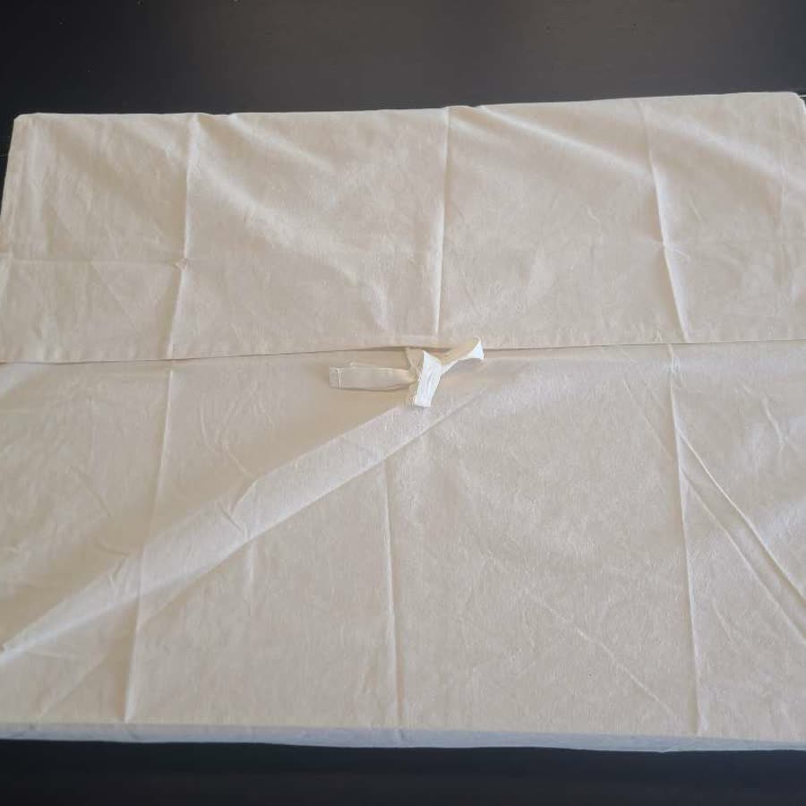 Finished preservation box wrapped in muslin and tied